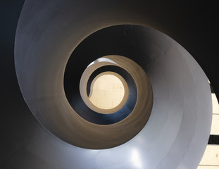 black spiral staircase with abstract shape