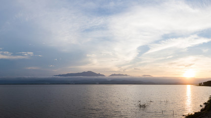 Beautiful lake and mountain during sunset landscape nature at Phayao Lake, Phayao, Thailand