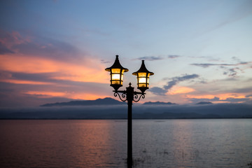 Obraz premium light lantern in mountain background and twilight darkness after sunset time romantic atmospheric.