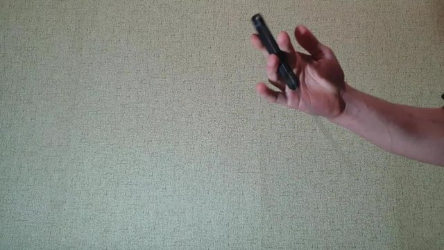 The man is twisting a knife in his hand slow motion.Knife in his hand.