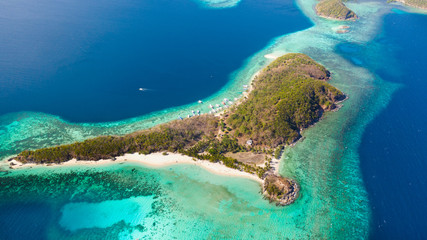 Islands and reefs of the Malay Archipelago.Beautiful island in the blue sea. Ditaytayan Island aerial view