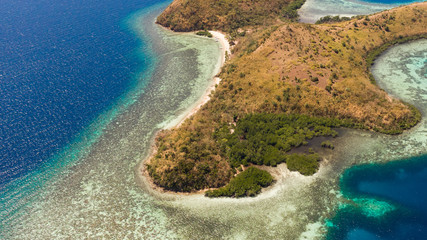 tropical island with coral reefs. Philippine Islands in clear weather aerial view.Philippines, Palawan