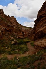 Narrow walking path between sandstones in Pingshan Grand Canyon National Park in Gansu province, China