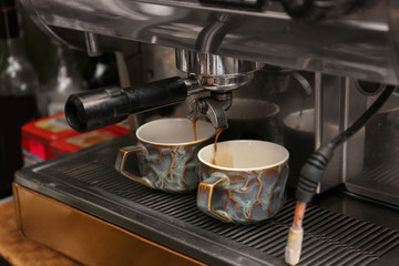 Fototapeta na wymiar Preparing fresh aromatic coffee using modern machine at cafe