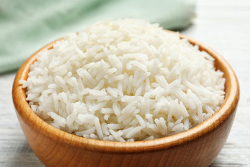 Bowl of tasty cooked white rice on table, closeup