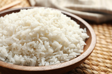 Plate of tasty cooked white rice on table, closeup