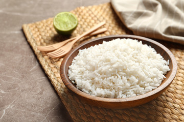 Fototapeta na wymiar Plate of tasty cooked rice served on table. Space for text