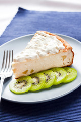 Homemade cottage cheese and semolina cake with kiwi fruit and cream