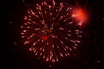 Fototapeta na wymiar Fireworks in the night sky over the city
