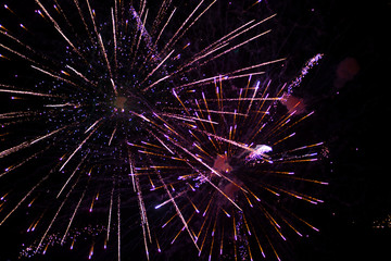 Fototapeta premium Fireworks in the night sky over the city