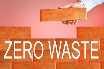 zero waste text on brick wall background. zero waste in industry.