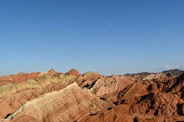 Small moon and colorful hills known as Rainbow mountains of China in Zhangye Danxia Landform Geological Park, Gansu province, China
