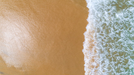 Tropical sea with wave crashing on beach aerial view drone shot