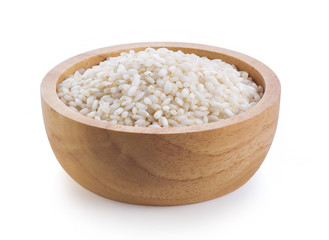 white rice in wood bowl isolated on white background. full depthb of field