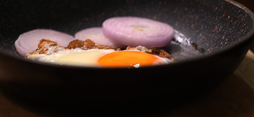  frying eggs with onions