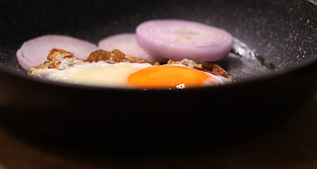  frying eggs with onions