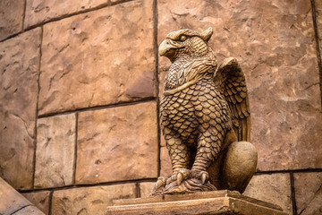 statue of Griffin or griffon a legendary creature with the body of a lion, the head and wings of an eagle