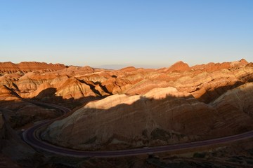 Colorful hills known as Rainbow mountains of China during sunset in Zhangye Danxia Landform Geological Park, Gansu province, China