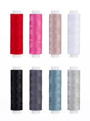 Set of sewing thread coils, miscellaneous colours, isolated on white