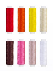 Set of sewing thread coils, miscellaneous colours, isolated on white