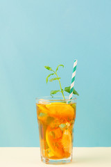 Iced tea with lemon slices, mint and ice