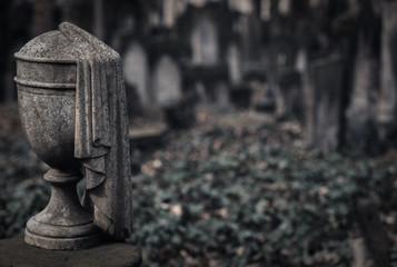 Decorative Stone Urn as a Headstone on a Cemetery - Symbol for Death, Grief, Remembrance