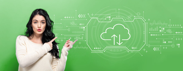 Cloud computing with young woman pointing on a green background