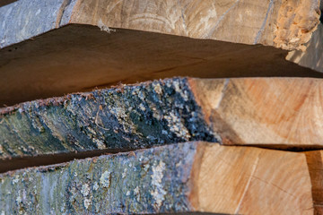 Folded wooden planks in a sawmill. Piled boards as texture