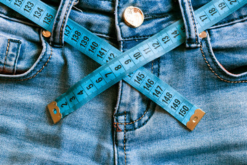 Denim pants, centimeter. diet, weight control. proper diet. healthy lifestyle.