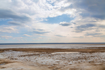 Lake shore and a beautiful cloudscape. Siberia