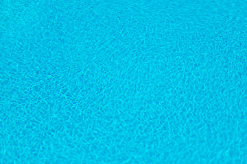 Water in swimming pool reflected sunlight background.