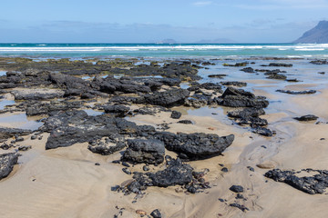 Rocks on the beach at La Caleta. Lanzarote. Canary Islands. Spain.