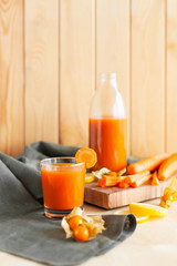 Wholesome carrot juice on rustic table