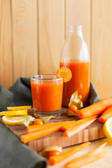 Wholesome carrot juice on rustic table