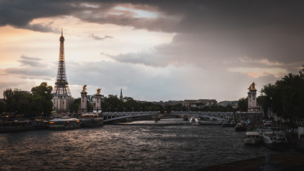 Fototapeta na wymiar The Seine River and the Eiffel Tower at sunset in Paris - Paris, France