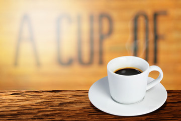 Coffee cup on wooden table on blurred of interior coffee shop. Business time with coffee, Coffee color brown background for product display, free copy space. Industrial food, drink background concept.
