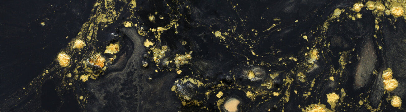Abstract marbleized effect background. black and gold creative colors. banner © tomertu