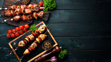 Kebab. Baked meat with onions and tomatoes. Barbecue. Top view. Free space for your text. Rustic...