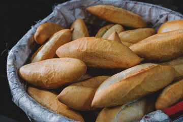 French Bread in Vietnam Style. Homemade Fresh Loaf in the Basket. Cafe preparing Baguette for Customer