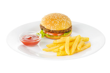 Burger with beef, meat cutlet, tomato, leaf lettuce, French fries and ketchup, barbecue sauce on plate, side view, isolated white background