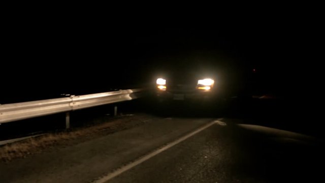 Car broken down on roadside at night with hazard lightsWhen your SUV breaks down, drive to the shoulder with blinkers on and wait for emergency services.