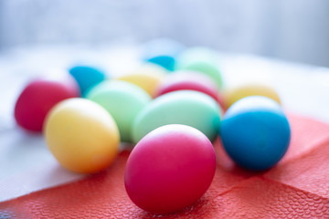 Fototapeta na wymiar colored multicolored eggs, blurred background