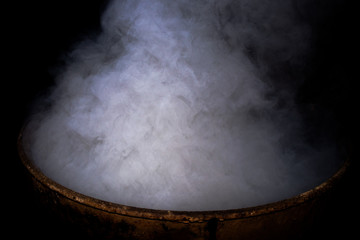 Smoke and dense fog on black background.