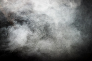 Smoke and dense fog on black background.