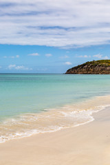 Fototapeta na wymiar A sandy beach on the Caribbean island of Antigua