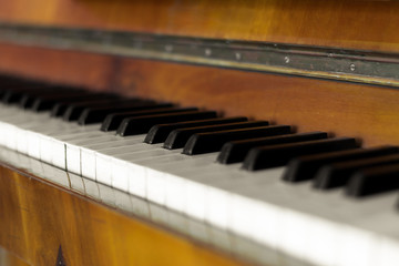 The keys of the old piano. Vintage wooden piano