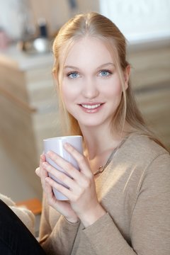 Young woman with tea mug