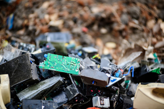 electronic circuits garbage as background from recycle industry - Powered by Adobe