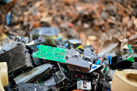 electronic circuits garbage as background from recycle industry - Powered by Adobe
