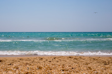 Fototapeta na wymiar summer seascape with waves and sand